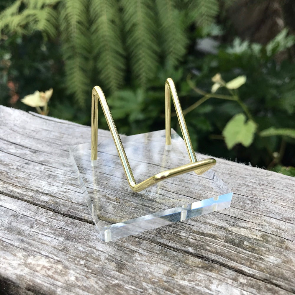 Gold stand with clear base